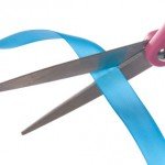 Scissors and ribbon Celebrating more than just opening our doors...