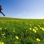 Businessman jumping on the field ways to bring joy une belle vie